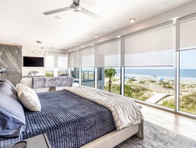 Features fully integrated Lutron shading system with custom in-ceiling pockets.