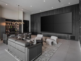 Custom Leon audio, Samsung video wall, JL subs, and hidden networking for whole-home connectivity.