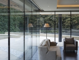 Lutron HomeWorks lighting control and automation, with motorised roller shades and curtain tracks.