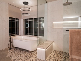 Primary bath with Lumaris linear lights, Ketra downlights, Lutron shades—all controlled by Josh.ai.