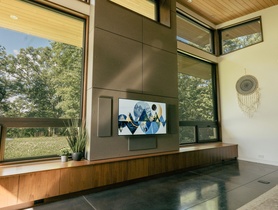 Hidden KEF THX Cinema Speakers flanking LG OLED TV.