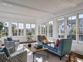 Architectural in-ceiling speakers blend into millwork, delivering even sound without visual distraction.