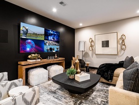 85" 4K Sony display with 5.1 surround sound, streaming services, Savant video tiling and control system.