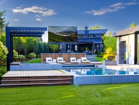 201-inch C-SEED outdoor TV in a backyard pool area. This unit features a 4K MicroLED display.