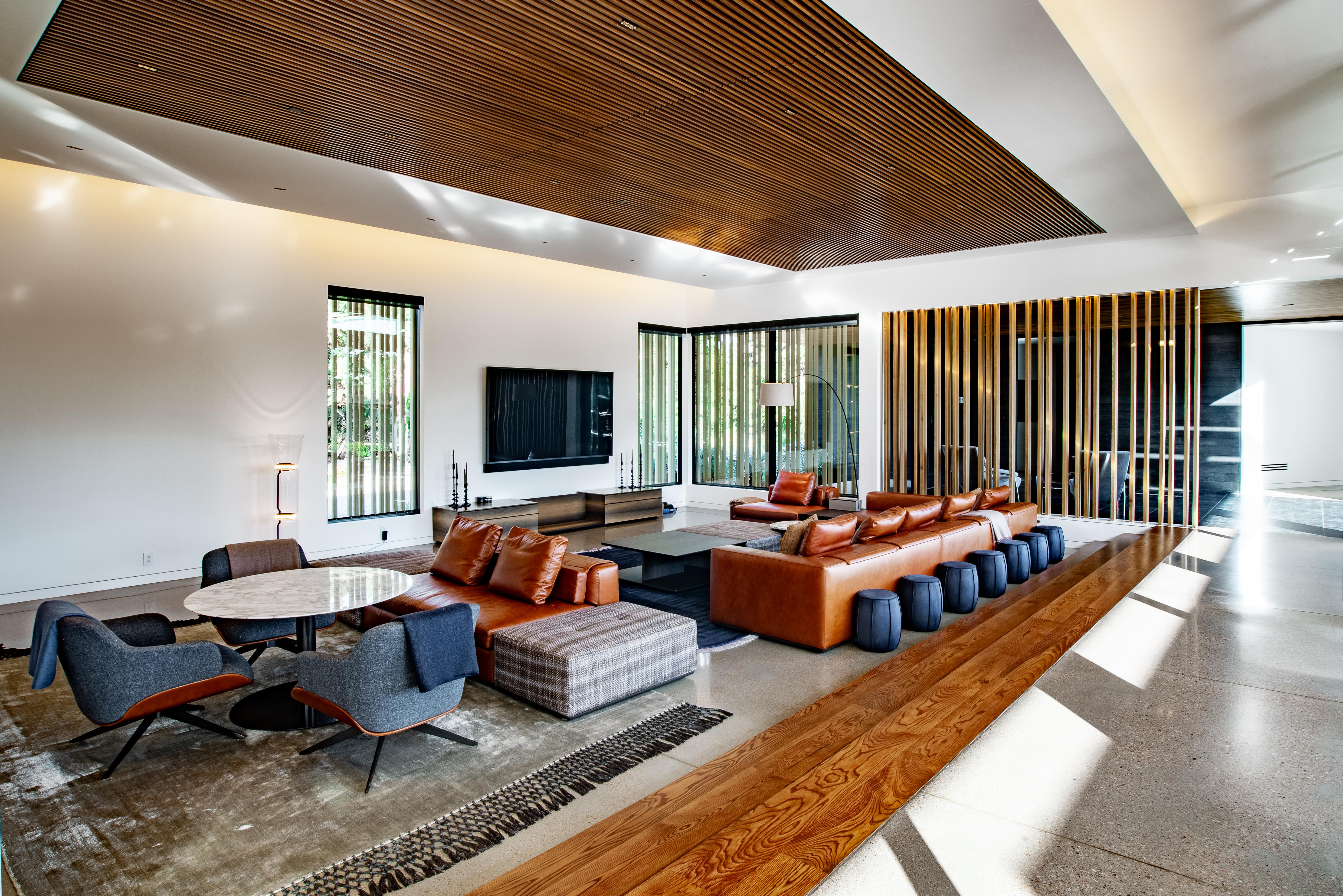 Logic Integration Control 4 automation, Origin Acoustics in-ceiling speakers, Screen Innovations shades, and layered lighting.